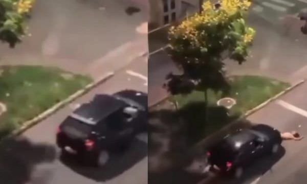Vídeo: após briga com companheiro, mulher deita na rua e carro passa por cima; imagens fortes