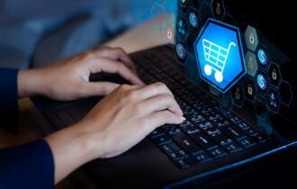double-exposure-shopping-cart-businesswoman-using-laptop